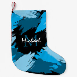 Brushstrokes skuggor av blå namn med monogram liten julstrumpa