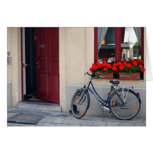Brygge, öppen dörr med cykel hälsningskort