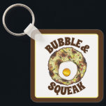 Bubble and Squeak Brunch UK British Food Cuisine Nyckelring<br><div class="desc">Livsmedelskonstruktionen har en originalmarkör som illustrerar "bubbla and squeak",  ett klassiskt brittiskt livsmedel som består av kål och potatis,  och som fylls med ett ägg.</div>