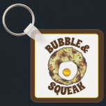 Bubble and Squeak Brunch UK British Food Cuisine Nyckelring<br><div class="desc">Livsmedelskonstruktionen har en originalmarkör som illustrerar "bubbla and squeak",  ett klassiskt brittiskt livsmedel som består av kål och potatis,  och som fylls med ett ägg.</div>