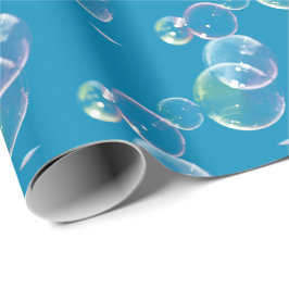 Bubblor i soap på blå presentpapper