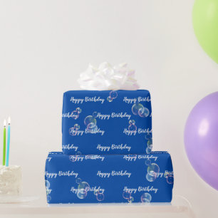 Bubblor om tvål i blått presentpapper