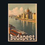 Budapest: Donau och parlamentets Vintage Vykort<br><div class="desc">"Journey in time with our Vintage Budapest Postcard, som fångar det fantastiska panorama från stadens ikoniska parlament som bygger längs den sceniska flodfronten. Njut av den nostalgiska allen av Ungerns huvudstad, som arkitekturmarvel återspeglar i flodens mjuka flodmynningar. Det här vykortet är mer än ett picturesque-minne. Det är en tidlös bild...</div>