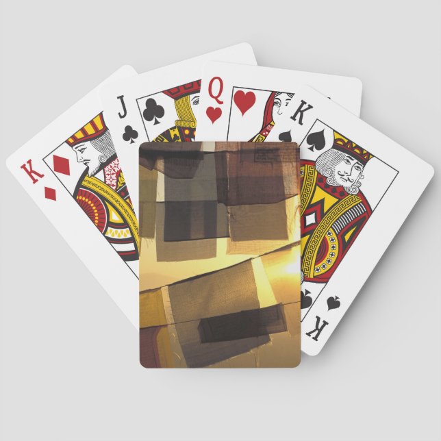 Buddhist prayer flaggor i solnedgången, spel kort (Baksidan)