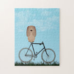 Buff Cocker Spain Hund Sitta på Vintage Bicycle Pussel<br><div class="desc">Pussel med en berömvärd Cocker-spanjor sitta på en gammaldags cykel på en blå sommardag.</div>