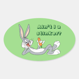 BUGS BUNNY™ Liggande och äter morot Ovalt Klistermärke