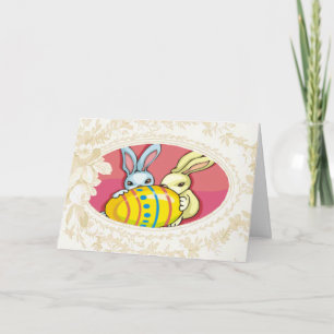 Bunnies spelar med ett äggkort helgkort