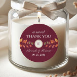 Burgundy Fall Wedding Thank You Runt Klistermärke<br><div class="desc">Add a charming seasonal touch to your wedding favors with this round fall thank you sticker. Designed with a deep burgundy background, watercolor autumn leaves, and a custom monogram crest, it features “a sweet thank you” with the couple’s names and wedding date. Perfect for sealing treat bags, boxes, or envelopes...</div>