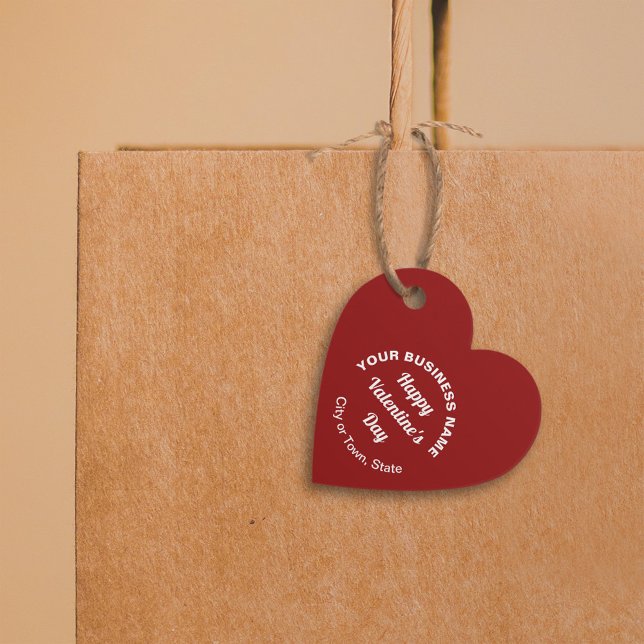 Business Valentine Hälsning på Red Heart Shape Gåvor Etiketter (Business Valentine heart shape red tag hung on shopping bag.)