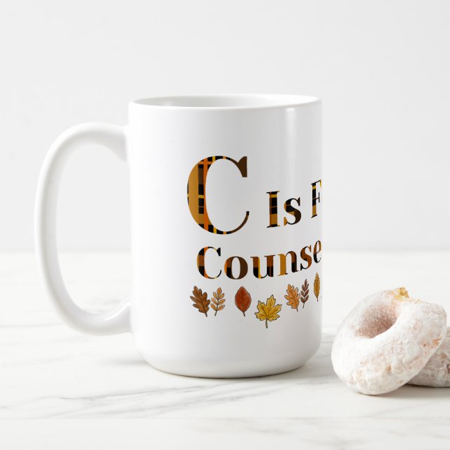 C står för skolrådgivare  kaffemugg (Med munk)