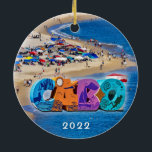 Cabos Medano Beach, Ceramic Ornament<br><div class="desc">Cabos Medanoband med färgfulla paraplyer och vackert väder. Kondominiumerna och den röda och vita fyren omger dockorna.</div>