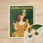 Cachou Lajaunie | Leonetto Cappiello Pussel<br><div class="desc">Cachou Lajaunie (1920) | Leonetto Cappiellos reklamfilm från 1920 poster för Cachou Lajaunie visar en slående bild av en rödhårig kvinna klädd i en djärv röd och gult, elegant rökning mot en mörk grönt rik. Kvinnans pulserande färg och dynamiska omgivning uppmärksammas omedelbart, vilket avspeglar Cappiellos namnteckning stil av djärva kontraster...</div>