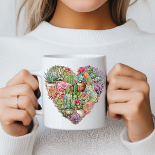 Cacti i en hjärtform kaffemugg