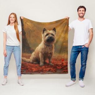 Cairn Terrier i höstlöv hösten inspirerar Fleecefilt