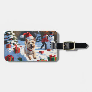 Cairn Terrier springer i snö med julhatt Bagagebricka