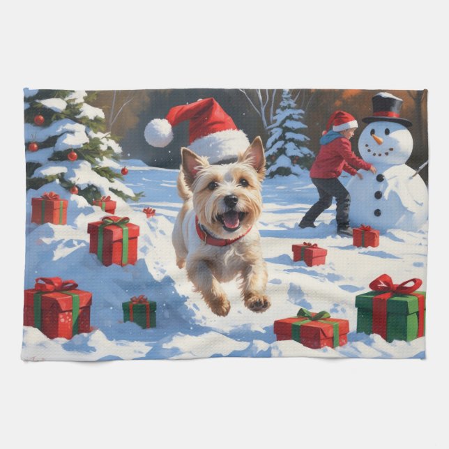 Cairn Terrier springer i snö med julhatt Kökshandduk (Horisontell)