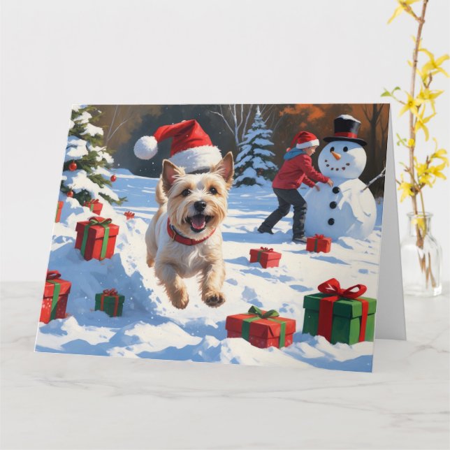 Cairn Terrier springer i snö med julhatt Kort (Gul blomma)