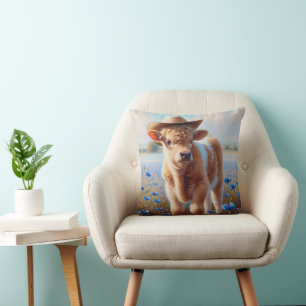 Calf med cowboyhatt i betesmark kudde