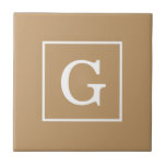 Camel Brown White Framed Monogram Kakelplatta<br><div class="desc">Camel Brown och White Framed Initial Monogram En solid snyggt med en vit ramyta för din monogram, namn eller annan text. Du kan också ändra teckensnittet, ändra teckensnittet storlekt och färg, flytta texten osv. Om du vill ha den här designen i andra färg kan du bara skicka ett e-postmeddelande till...</div>