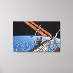 Canadarm2en och den sol- samlingpanelvingar canvastryck