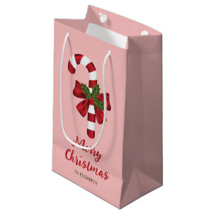 Candy Cane Med En Båge Och Julgran På Rosa