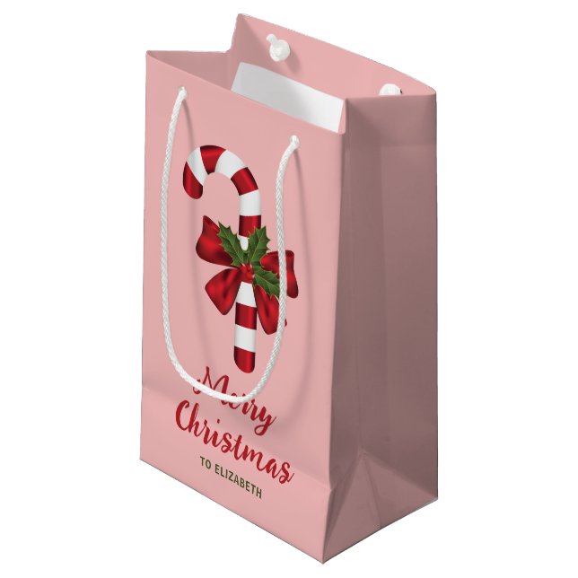 Candy Cane Med En Båge Och Julgran På Rosa (Framsidan Vinklad)