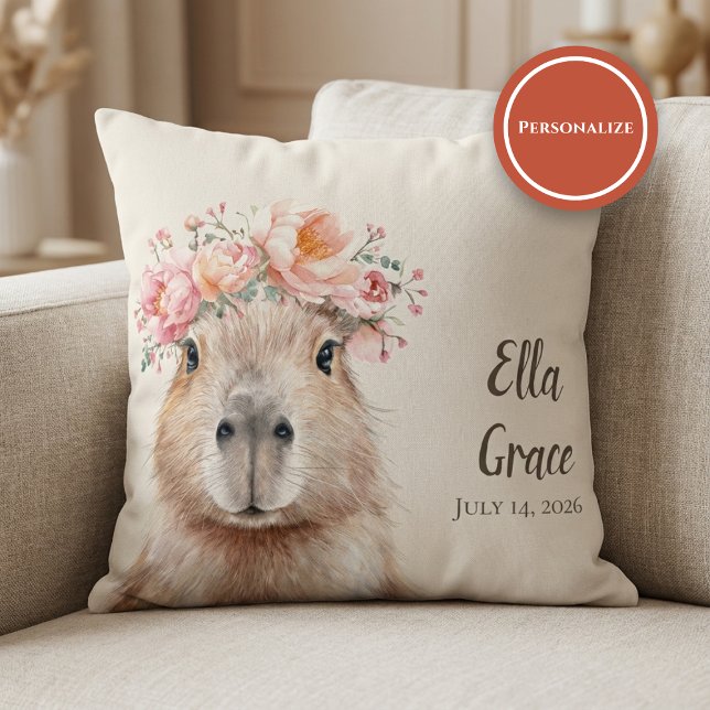 Capybara Baby Nursery • Personalized  Kudde (soft nursery pillow with floral capybara illustration on beige sofa setting)