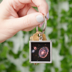 Carthjulet Galaxy och dess assistent Galaxies. Fyrkantig Silverfärgad Nyckelring