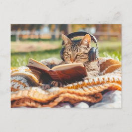 Cat reading book on knitted blanket helg vykort