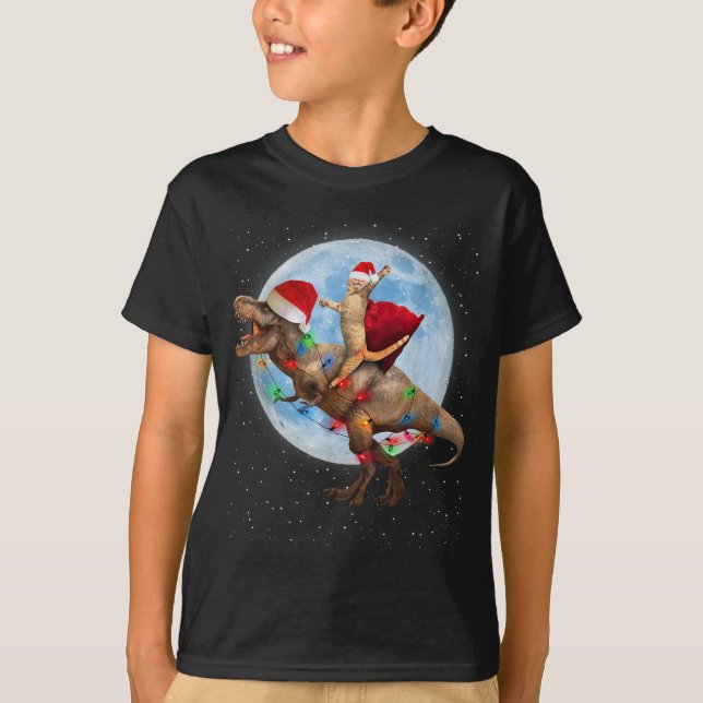 Cat Santa Hat Riding Dinosaur T rex Måne jul T Shirt (Framsida)