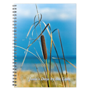 Cattail vid anteckningsboken för anteckningsbok med spiral