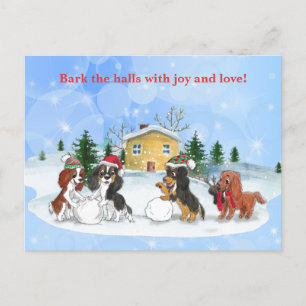 Cavalier King Charles Spaniels bygger en snöman Helg Vykort
