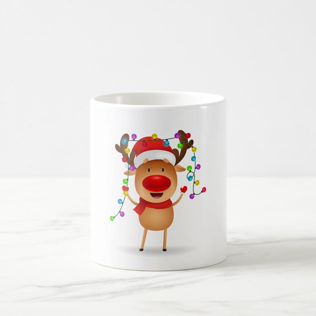 Cheerful Reindeer Coffee Mugg (Illustration of a reindeer wearing a red Santa hat and scarf.)