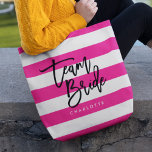 Chic Rosa and White Rand Black Team Bride Tygkasse<br><div class="desc">All-over-Print Tote med ord "Team Bride" i svart trendig mot rosa och vit rand mönster-bakgrund. Perfekt till bröllop för brudgummar, maid of honor och blomsterflicka. Mer information om matchande objekt finns på https://www.zazzle.com/collections/119250194970828530?rf=238364477188679314 Anpassa den genom att ersätta platshållartexten. Om du vill ha fler alternativ som att ändra teckensnittet och det...</div>