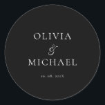Chic Script Black Minimalist Wedding Runt Klistermärke<br><div class="desc">Add a personal and elegant touch to your wedding favors, envelopes, or packaging with this minimalist round sticker featuring your custom name in a graceful script font. Designed to complement a modern and timeless wedding theme, this classic black-and-white design pairs beautifully with any part of your celebration. Perfect for sealing...</div>