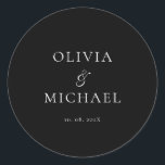 Chic Script Black Minimalist Wedding Runt Klistermärke<br><div class="desc">Add a personal and elegant touch to your wedding favors, envelopes, or packaging with this minimalist round sticker featuring your custom name in a graceful script font. Designed to complement a modern and timeless wedding theme, this classic black-and-white design pairs beautifully with any part of your celebration. Perfect for sealing...</div>