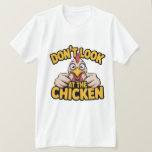 Chicken Game - Dont Look At The Chicken T-Shirt<br><div class="desc">Bold cartoon chicken graphic with playful typography in a vibrant yellow palette, delivering cheeky humor. Ideal for novelty tees and casual apparel for chicken lovers and punchy streetwear vibes.</div>