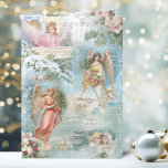 Choir Vintage jul Winter Änglar Collage Helgkort<br><div class="desc">Charming collage of vacker Victorian änglar,  snö-täckt gräs,  ro,  holly,  julmusik,  typografi,  evergreens och jordlandskap på landsbygden som gränsar till ömtåliga vita filigree på ljusblå himlar-bakgrund.</div>