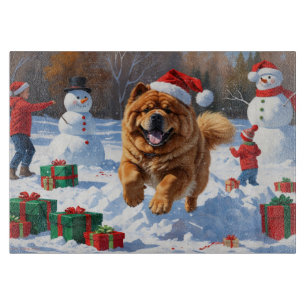 Chow Chow springar i snö med julhatt