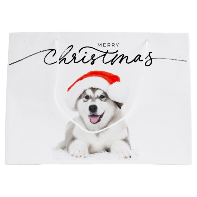 CHRISTMAS GIFT BAG MED HUSKY PUPPY I SANTA HAT (Framsidan)
