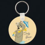 Cindy Bear Holding Parasol Nyckelring<br><div class="desc">Lägg till ett litet charm med den här fina Cindy Bear-teckningen! Med Yogi Bear-elegantens följeslagare i en graciös situation, som håller henne namnteckning blå parasol, fångar den här illustrationen hennes söta och snyggt personlighet. Med en retro-animering stil och ett sjudande färg, ger den här nostalgiska designen Jellystone Park-magin till liv....</div>