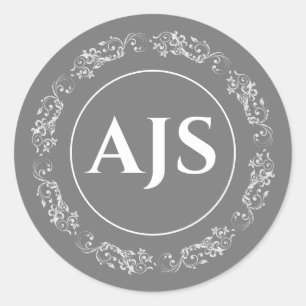 Cirkulär monogramdesign i grått och vitt. runt klistermärke