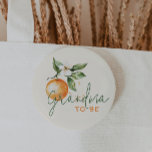 Citrus Little Cutie Baby Shower Grandma To Be Knapp<br><div class="desc">Introducing our citrus little cutie baby shower grandma to be button, perfect for a fun, gender-neutral celebration! This zesty design features a delightful citrus orange clementine fruit theme, brought to life with a simple boho-inspired watercolor style. It is ideal for welcoming a little boy or girl in a joyful and...</div>