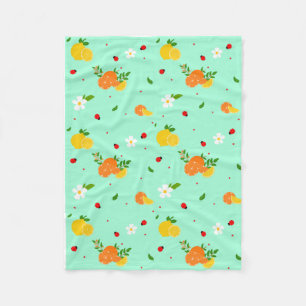 Citrus- och nyckelpigebotaniskt mönster med blommo fleecefilt
