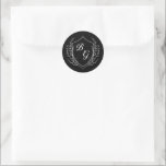 Classic monogram wedding crest black and white runt klistermärke<br><div class="desc">Minimalist black and white wedding envelope stickers featuring a vintage-inspired monogram crest. The fine line art design is accented with graceful leaves on each side,  creating a timeless and elegant emblem for your special day. Paired with classic typography,  it's the perfect touch of understated sophistication.</div>