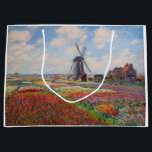 Claude Monet - Fält i Tulips i Nederländerna<br><div class="desc">Fält i Tulips in Holland (Champs de tulipes en Hollande) - Claude Monet,  Oil on Canvas,  1886</div>