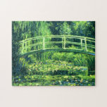 Claude Monet: Överbrygga över ett damm av Pussel<br><div class="desc">Ett underbart klassikerpussel som presenterar en överbrygga över ett damm av näckrosor som målas av den franska impressionistmålare Claude Monet.</div>