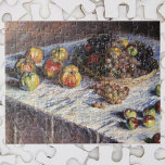 Claude Monets livsstil med äpplen och druvor Pussel<br><div class="desc">Livet med äpplen och druvor (1880) av Claude Monet är fortfarande en vintage bra konst som fortfarande är livmålning. Olika frukter i basket på bord, inklusive äpplen och druvor avsedda för Thanksgiving middag. Om konstnären: Claude Monet (1840-1926) var en av grundarna av den Fransk målningsrörelsen och de flesta av hans...</div>