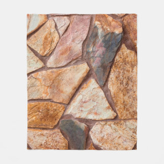 Closeup of a stone wall as a backgroundwallpaper,p fleecefilt