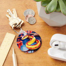 Cobra med pulverröd och gult i träd nyckelring